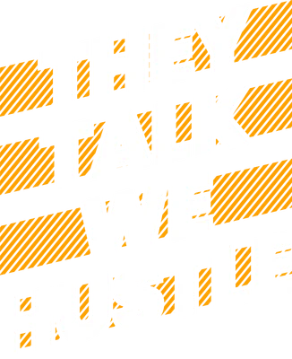 Hình in chữ 'THEY TALK WE HUSTLE' màu trắng trên nền xám với các dải sọc cam, phong cách typography hiện đại.